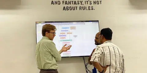 Working a problem through on the whiteboard